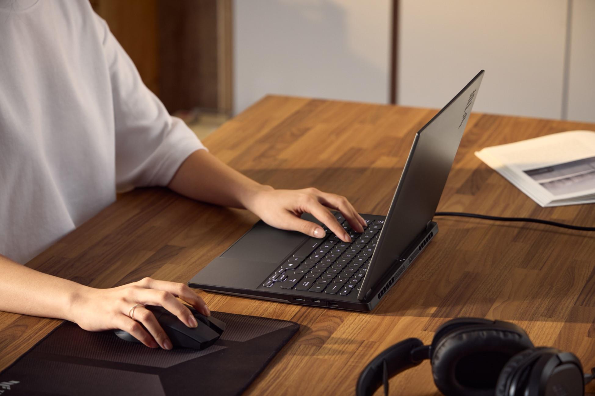 An ASUS laptop being used on an office desk